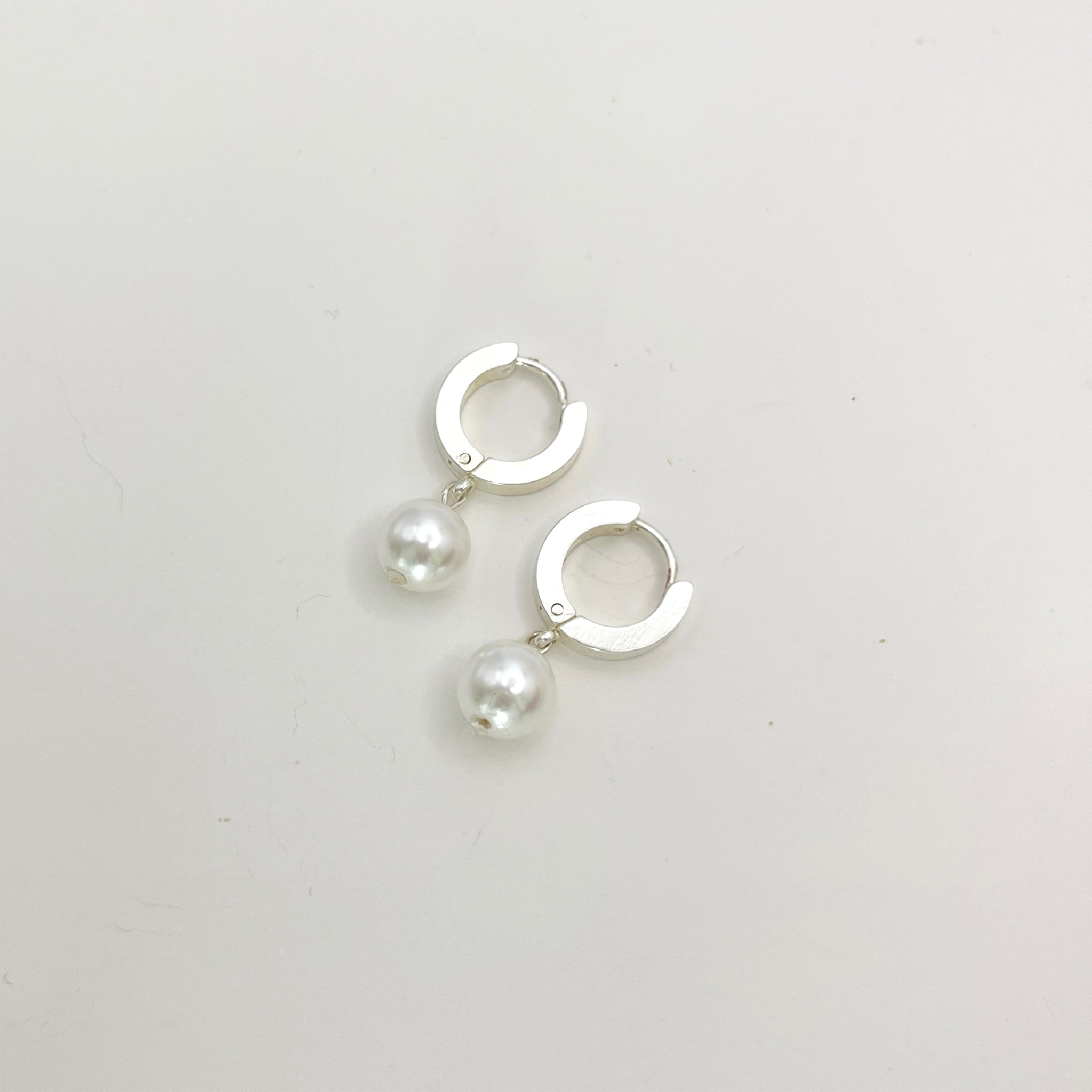 Stainless Steel Huggie Earrings with Pearl Charm