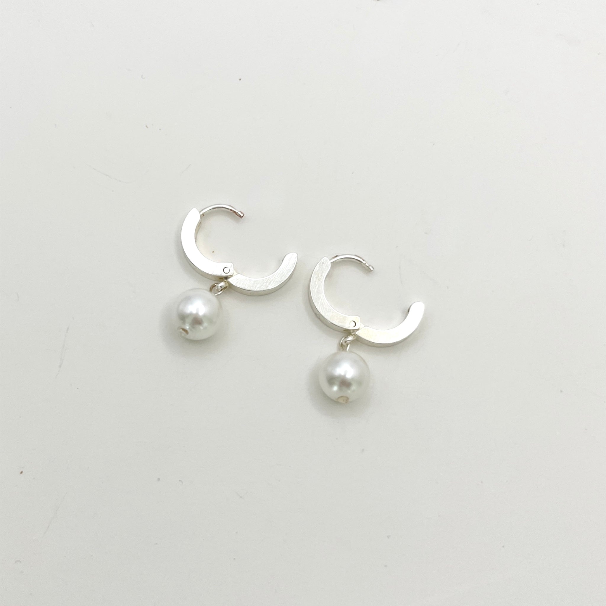 Stainless Steel Huggie Earrings with Pearl Charm