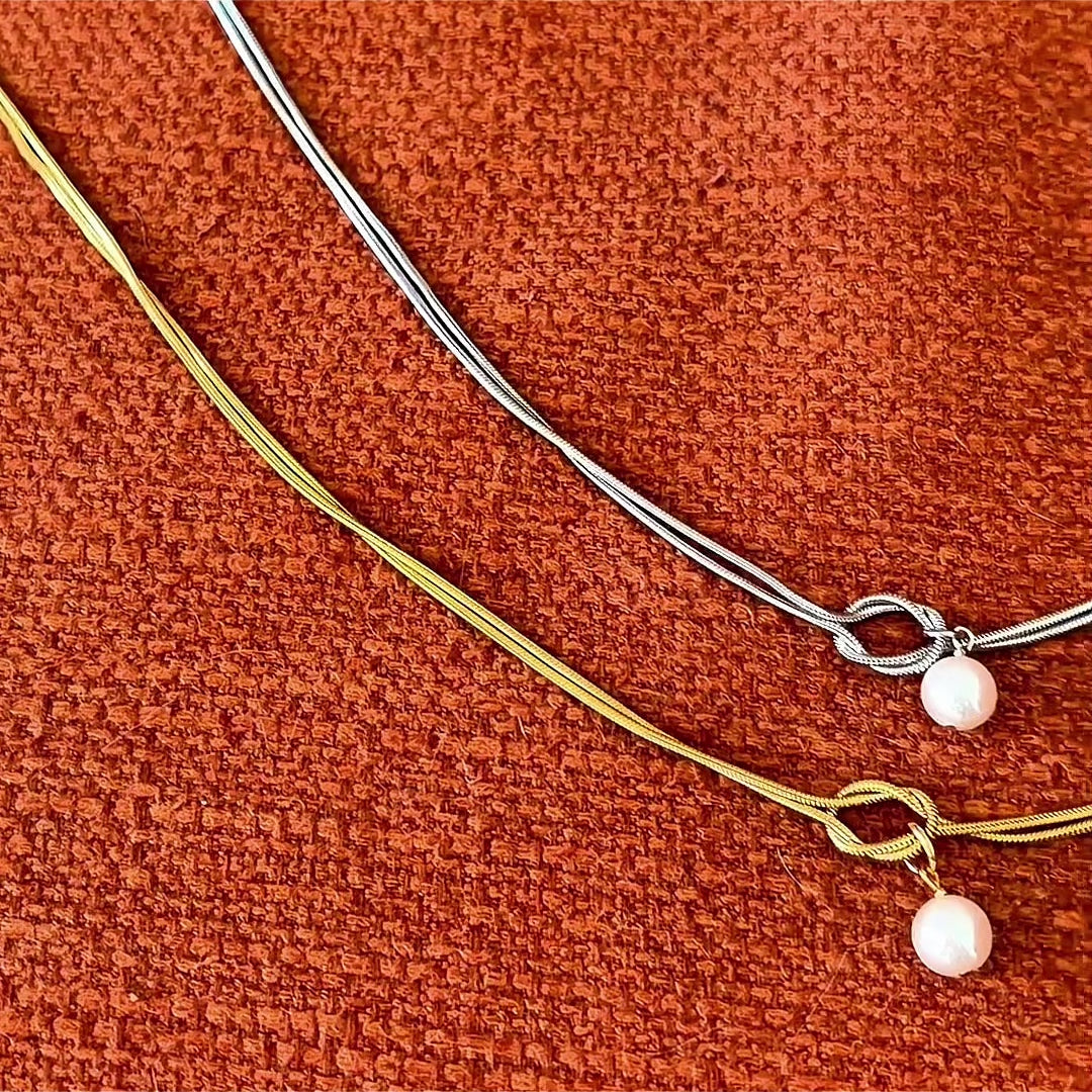 Load video: Intertwined Parallel Snake Chain Knot Necklace with 8mm Shell Pearl Drop